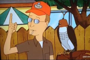 Dale pointing skyward with a falcon on his other gloved arm